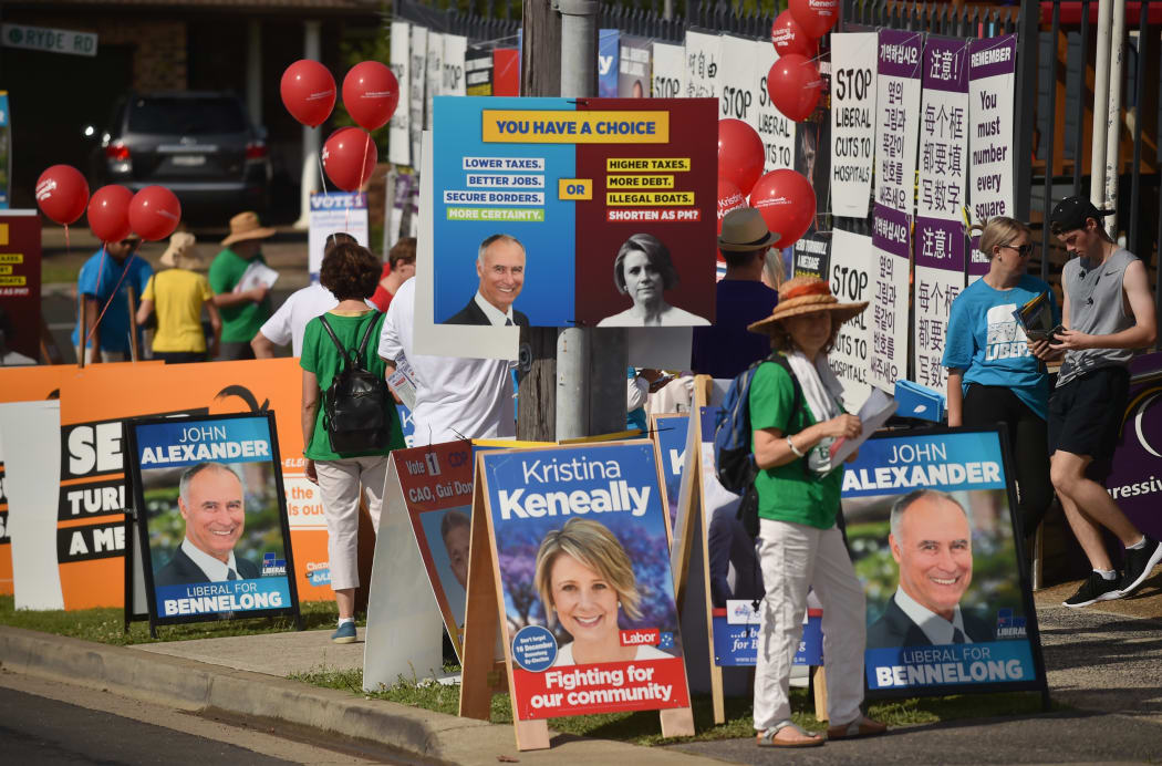 Banners and placards outside a polling station in the suburban seat of Bennelong in Sydney