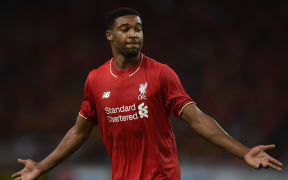 Liverpool's English midfielder Jordon Ibe celebrates after scoring a goal.