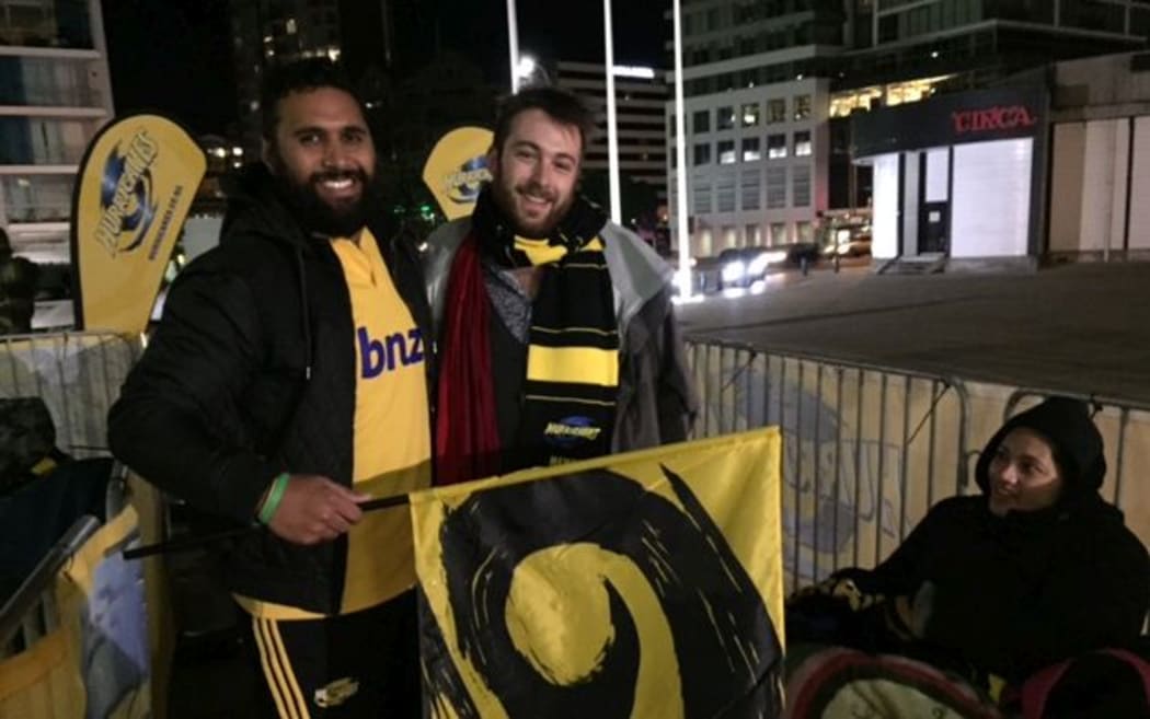 Hurricanes fans settle in for the wait for tickets last night.