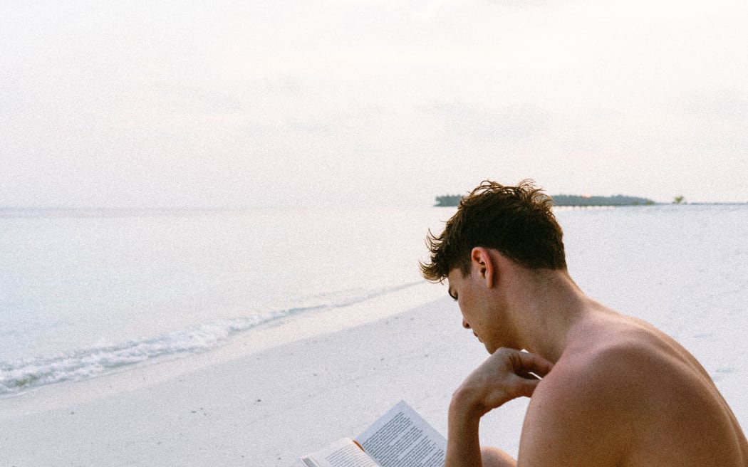 young man reading