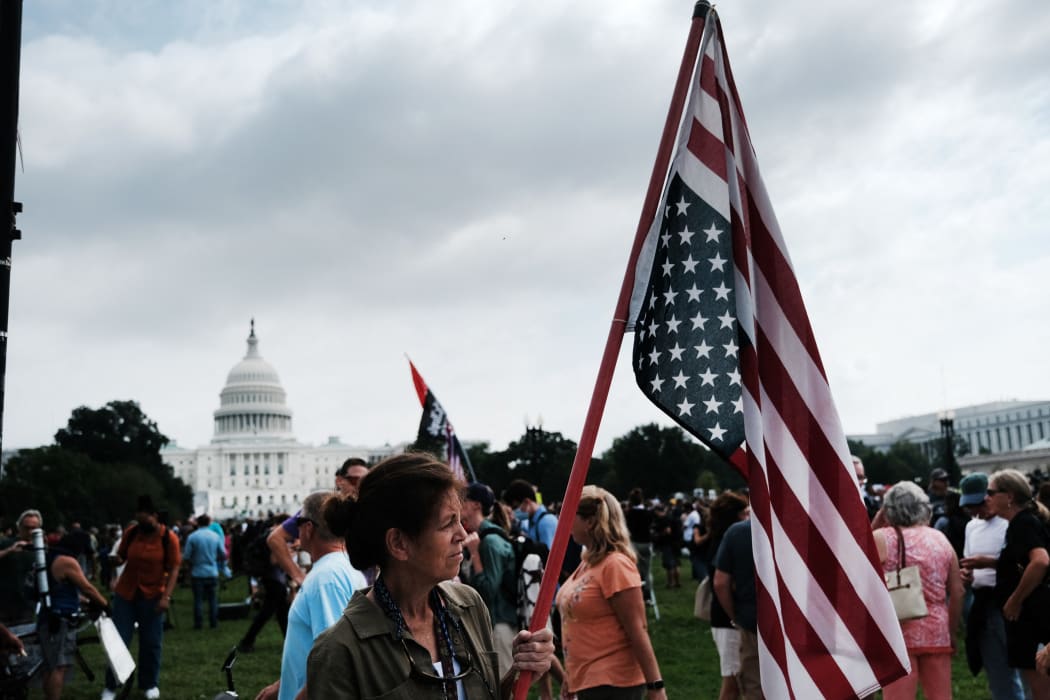 Supporters of those charged in the 6 January attack on the US Capitol attend the Justice for J6 rally on Saturday.