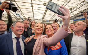 Deputy First Minister of Northern Ireland and Irish republican Sinn Fein party member Michelle O'Neill (centre L) with Sinn Fein party President Mary Lou McDonald (centre R) in Magherafelt, Co Londonderry, on 7 May 2022.
