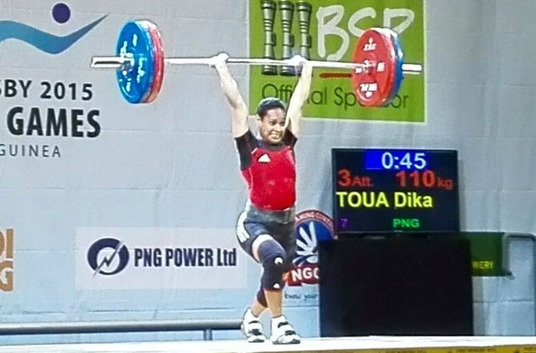 Papua New Guinea's Dika Toua wins weightlifting gold at the Pacific Games.