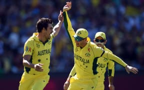 Australian bowler Mitchell Starc and captain Michael Clarke celebrate the wicket of New Zealand captain Brendon McCullum during the Cricket World Cup Final in 2015 at the MCG.