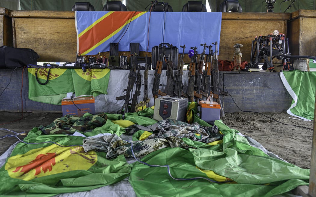 Weapons and military uniforms used by defendants in a failed coup attempt are on display during a verdict hearing at Ndolo prison in Kinshasa on September 13, 2024. Three Americans were among 37 people sentenced to death on September 13, 2024 in the Democratic Republic of Congo over what the army says was a coup attempt.
Death sentences were also handed down to a Belgian, Briton and Canadian, all naturalised Congolese. (Photo by Hardy BOPE / AFP)