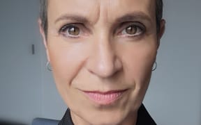 This is a headshot of Cass. She is looking straight into the camera