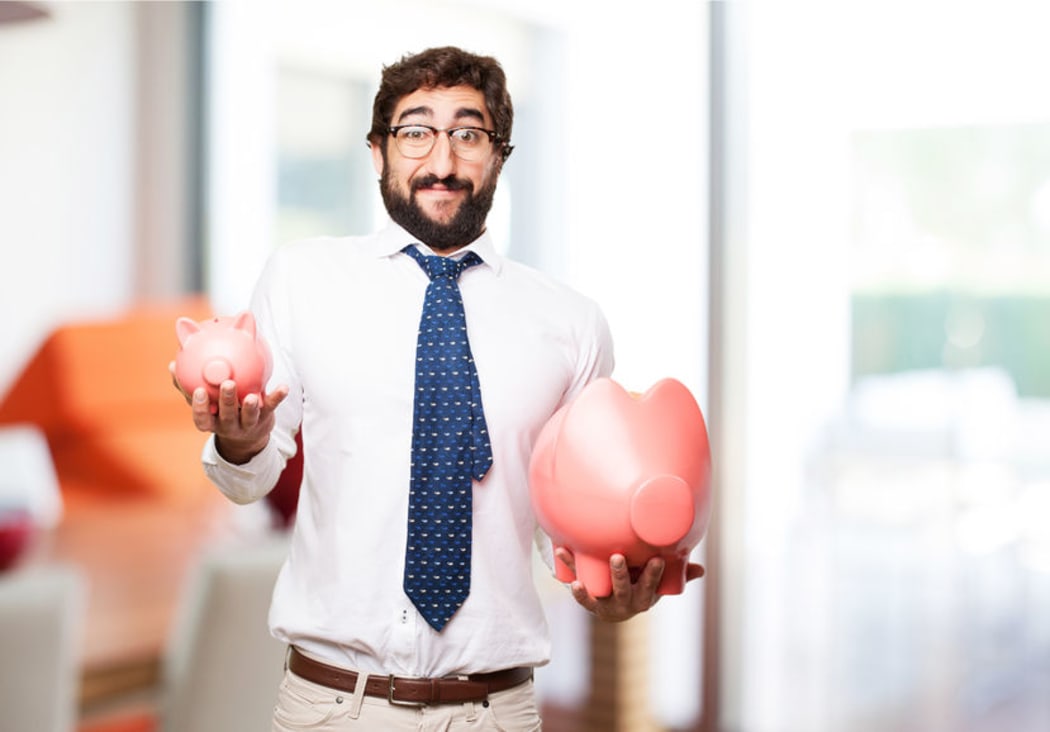 Man holding piggy banks