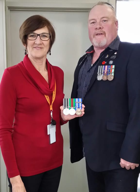 Christine Chambers is reunited with her son’s stolen medals after former sailor Kelly Kidd started a social media campaign to find their rightful owner.