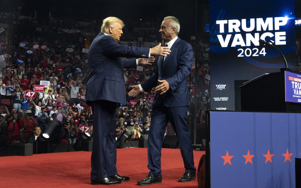 GLENDALE, ARIZONA - AUGUST 23: Republican presidential nominee, former U.S. President Donald Trump (L) embraces former presidential candidate Robert F. Kennedy Jr. during a campaign rally at Desert Diamond Arena on August 23, 2024 in Glendale, Arizona. Kennedy announced today that he was suspending his presidential campaign and supporting former President Trump.   Rebecca Noble/Getty Images/AFP (Photo by Rebecca Noble / GETTY IMAGES NORTH AMERICA / Getty Images via AFP)
