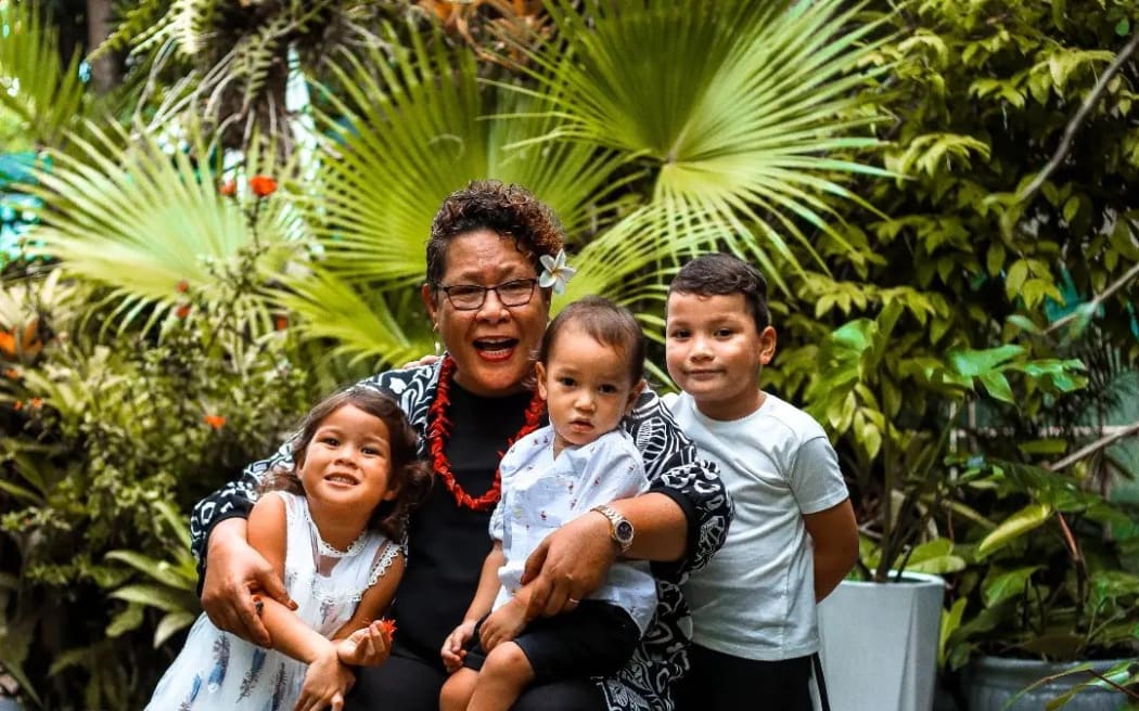 Nina has been nominated for her great services to Pacific Development with an Honorary Queen's service medal. She is posing with her grandchildren.