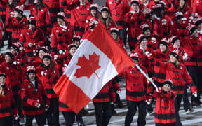 The Canadian flag bearer at the 2014 Winter Olympics.