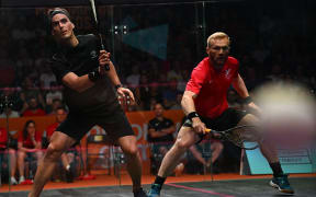 New Zealand's Paul Coll, left. plays against Joel Makin of Wales in the men's singles gold medal squash match on day six of the Commonwealth Games in Birmingham, England, on 3 August, 2022.