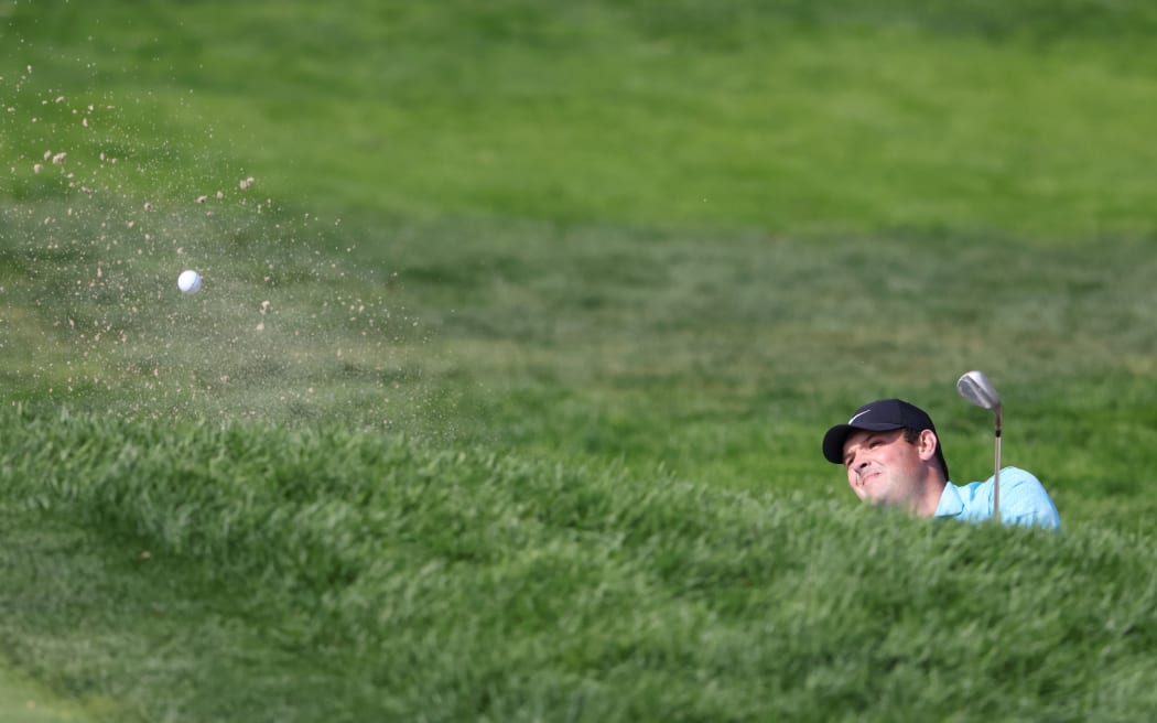 Patrick Reed of the United States plays a third shot from a bunker on the 17th hole during the second round of the 120th U.S. Open Championship on September 18, 2020 at Winged Foot Golf Club in Mamaroneck, New York.