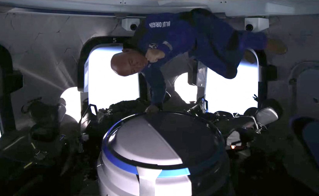 Jeff Bezos celebrating catching popcorn in his mouth during the 20 July 2021, space flight.