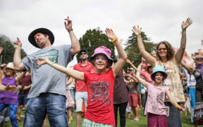 People of all ages get to their feet