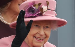 Queen Elizabeth II waves after attending the ceremonial opening of the sixth Senedd, in Cardiff, Wales on 14 October 2021.