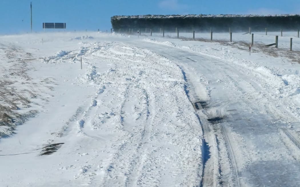 Strong winds are blowing snow onto the closed section of State Highway 87, near Clarks Junction this morning