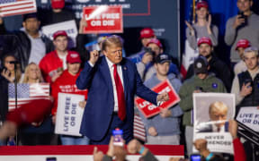 DURHAM, NEW HAMPSHIRE - DECEMBER 16: Republican presidential candidate, former U.S. President Donald Trump reacts during a campaign event at the Whittemore Center Arena on December 16, 2023 in Durham, New Hampshire. Trump is campaigning ahead of the New Hampshire primary on January 23.   Scott Eisen/Getty Images/AFP (Photo by Scott Eisen / GETTY IMAGES NORTH AMERICA / Getty Images via AFP)
