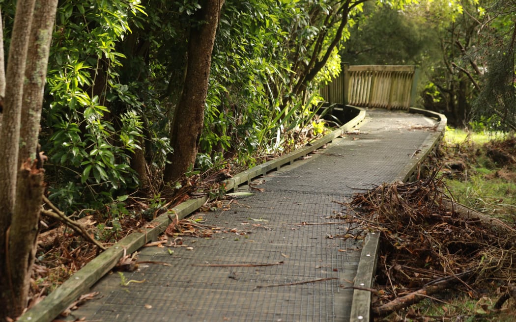 The Waititiko Meola Creek flooded the walkway and left debris in its wake.