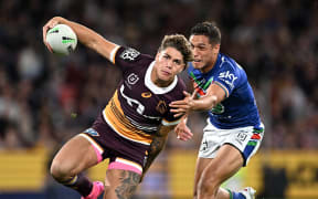 Broncos player Reece Walsh gets past Te Maire Martin of the Warriors  during the NRL preliminary final between the Brisbane Broncos and the New Zealand Warriors at Suncorp Stadium in Brisbane, Saturday, September 23, 2023. (AAP Image/Dave Hunt/www.photosport.nz)