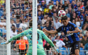 Auckland FC's Logan Rogerson scores.