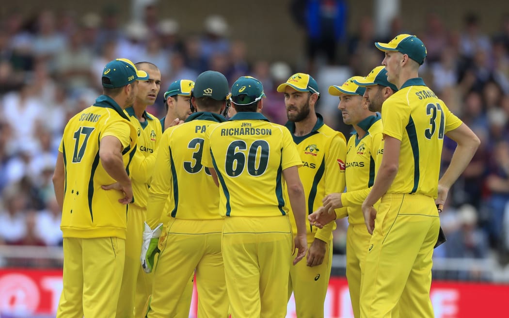 Australian cricket captain Tim Paine talks to his team.