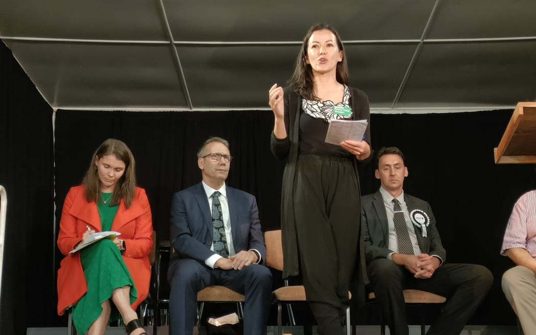 Lan Pham speaking at a candidates’ meeting during the 2022 general election