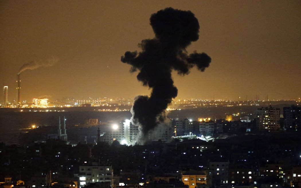Smoke billowing from buildings in Gaza City after an Israeli airstrike.