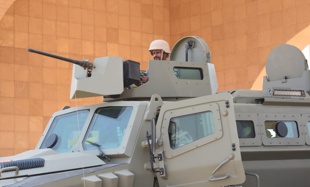 Saudi border guards stand guard in the closed al-Tuwal border crossing with Yemen in the southern Jizan province on October 3, 2017.