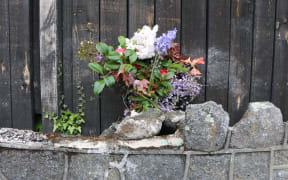 Flowers left at the site of the crash.