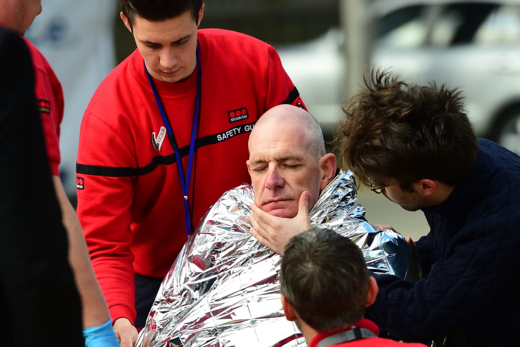 A victim receives first aid near Maalbeek metro station in Brussels.