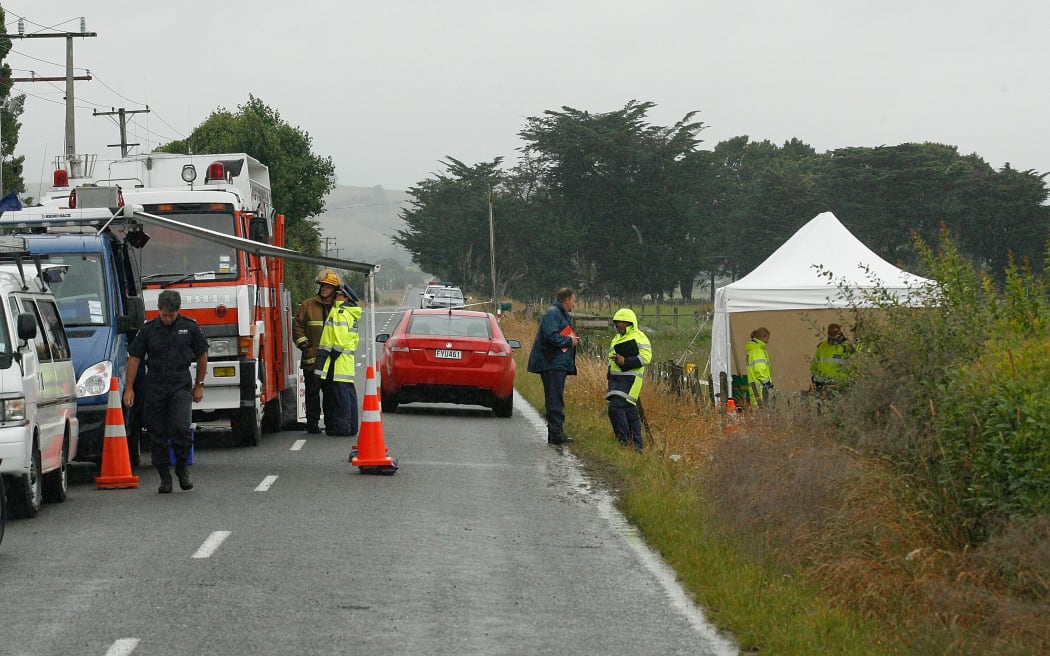 Police and firefighters at the site of the balloon crash on 8 January 2012.