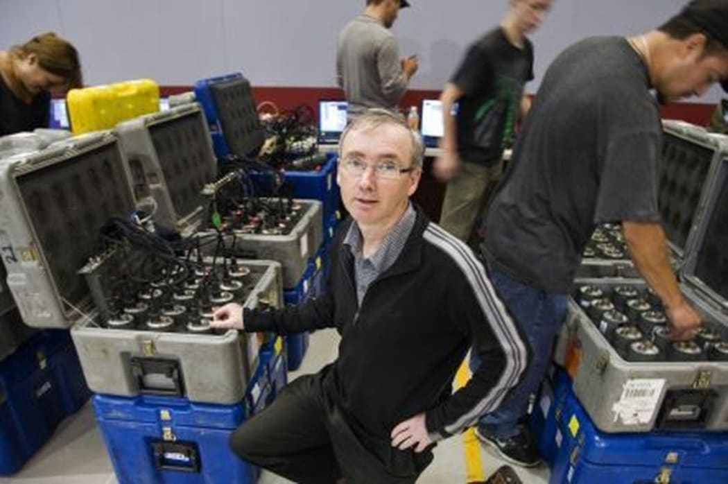 Stuart Henrys, at GNS Science, prepares some of the seismic recorders for deployment in the field. 900 of these instruments were set up across the lower North Island to monitor a series of explosions.