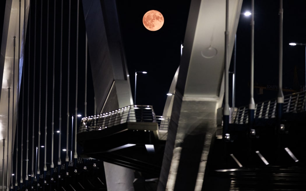 A sturgeon supermoon rising over the Frederick Douglass Memorial Bridge in Washington, DC on 1 August, 2023.