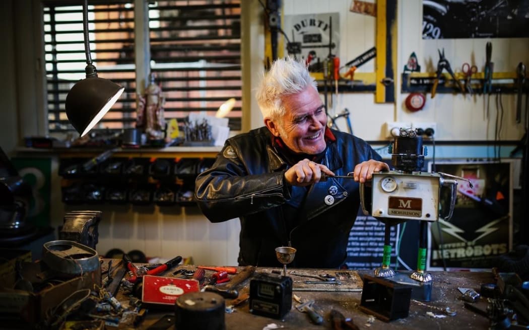 Martin Horspool making a robot in his workship