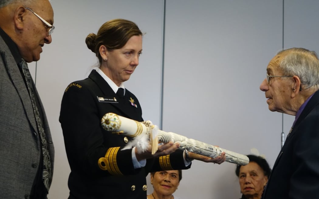 Endeavour Commander Sandra Walker receives the new symbol of command from Ngati Te Whiti kaumatua Rangikotuku Rukuwai.