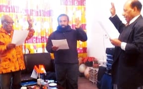 Jeffrey Bomanak (middle) takes oath as chairman of the Free Papua Movement (OPM) from Jacob Prai (right) in Sweden in 2017.