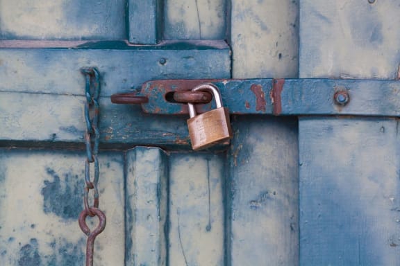 An image of a locked shipping container