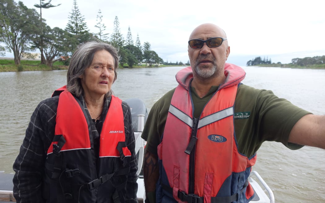 Green MP Cathrine Delahunty and Friends of the Waitara member Robbie Taylor discuss pollution issues in the river.