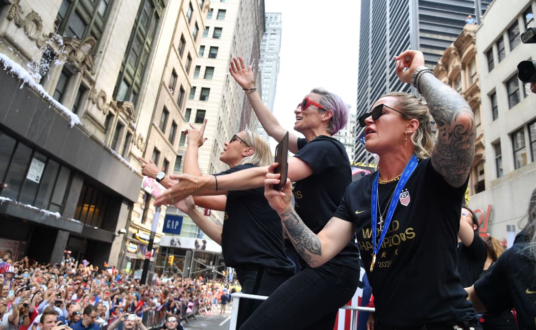 Megan Rapinoe (C) and members of the World Cup-winning US women's soccer team take part in a ticker tape parade for the women's World Cup champions on July 10, 2019 in New York.