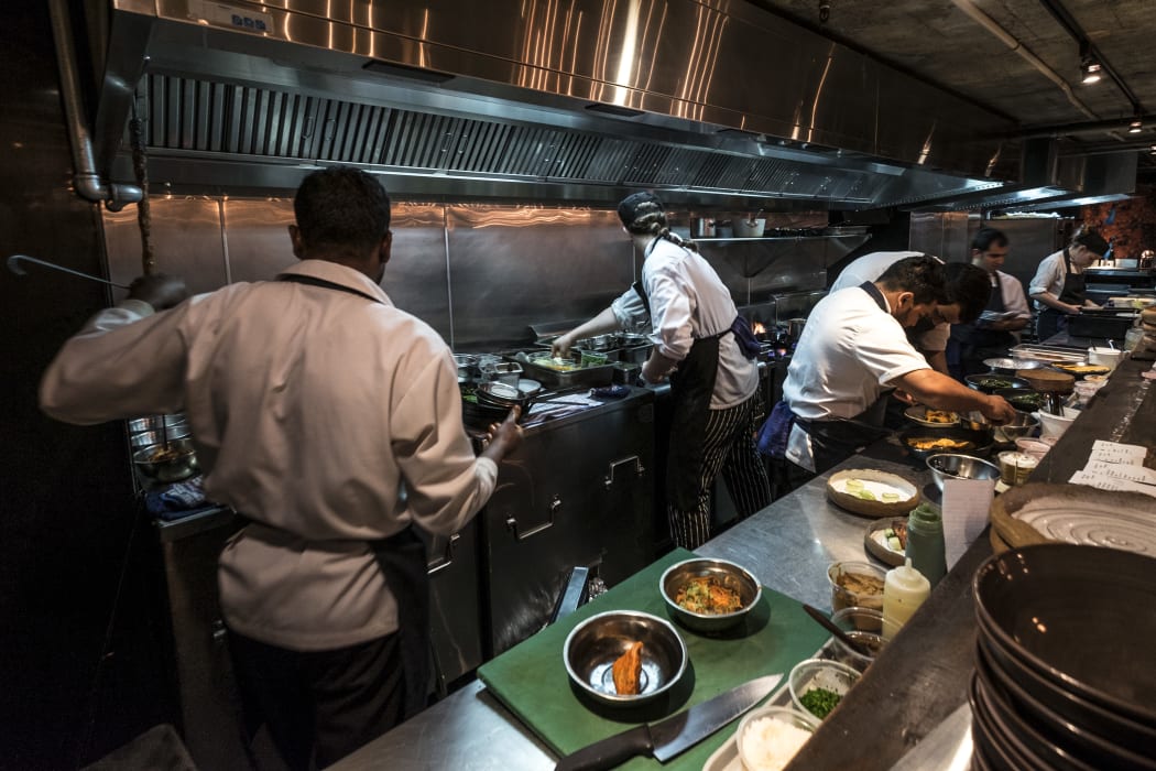 Kitchen staff in Cassia Restaurant on Fort Lane, Auckland City.