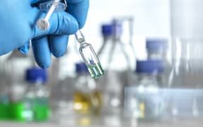 Pharmaceutical research Scientist developing a new drug or vaccine in the lab.