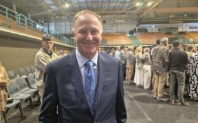 Former prime minister Sir John Key at a ceremony for the graduation of a police recruit wing in Auckland on 14 November 2025.