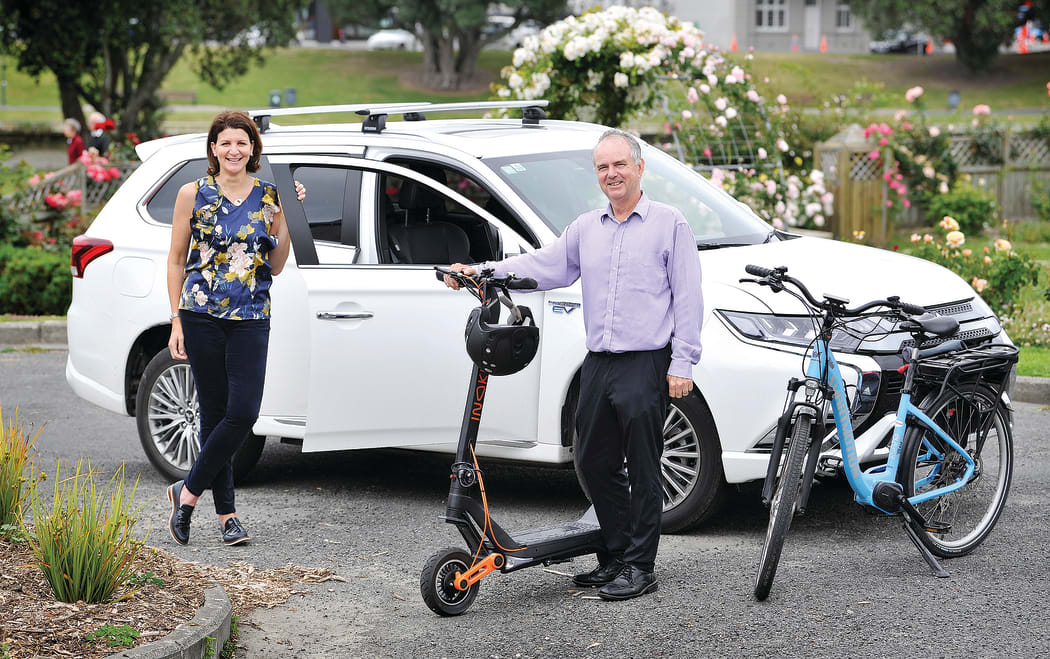Rehette Stoltz with the new mayoral car – a Mitsubishi Outlander hybrid – and Gisborne District Council asset manager Simon Jeune with one of the council’s e-scooters and an e-bike, which are part of a drive to get the council moving in an environmentally friendly way