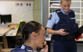 Constable Yvonne Tremain in Hastings makes calls to contact people following Cyclone Gabrielle.