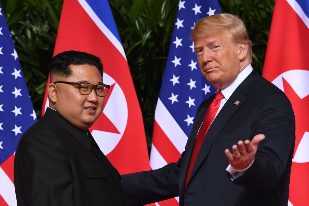 Donald Trump (right) meets with North Korea's leader Kim Jong Un at the start of their US-North Korea summit in June 2018.