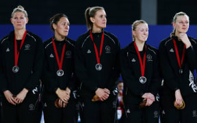 A disappointed Silver Ferns side with their silver medals at the Glasgow Commonwealth Games.