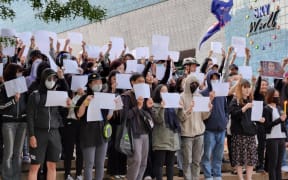 Protestors held white A4 paper as a symbol of defiance against censorship by the Chinese government.