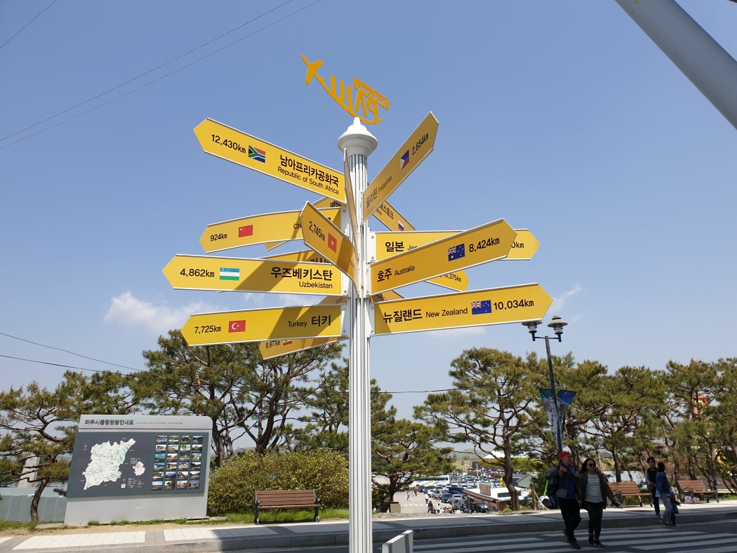 At the DMZ, a signpost to New Zealand.