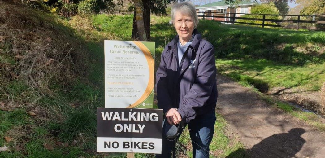 Jessica Maxwell with a walking only sign at Tainui Reserve in Havelock North.